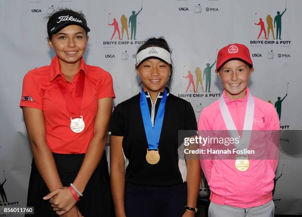 Second, first and third place overall for the girls 12-13 category Alexa Pano, Vunnisa Vu and Treva Dodd pose for a photo at the regional round of...