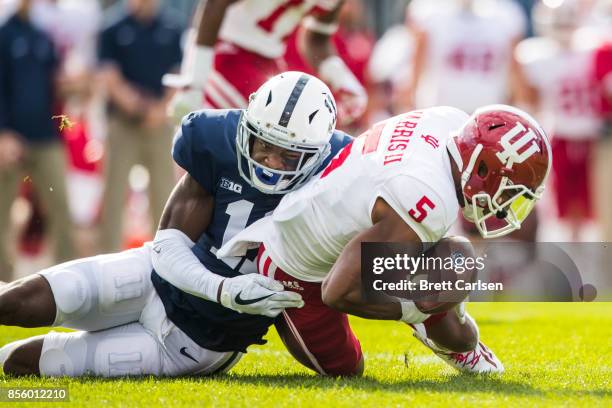 Irvin Charles of the Penn State Nittany Lions strips the ball from J-Shun Harris II of the Indiana Hoosiers during a punt return, Penn State...