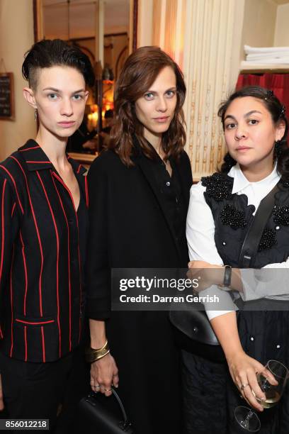 Guest, Aymeline Valade and Simone Rocha attend a dinner in Paris to celebrate Another Magazine A/W17 hosted by Vivienne Westwood, Andreas Kronthaler,...