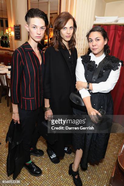 Guest, Aymeline Valade and Simone Rocha attend a dinner in Paris to celebrate Another Magazine A/W17 hosted by Vivienne Westwood, Andreas Kronthaler,...
