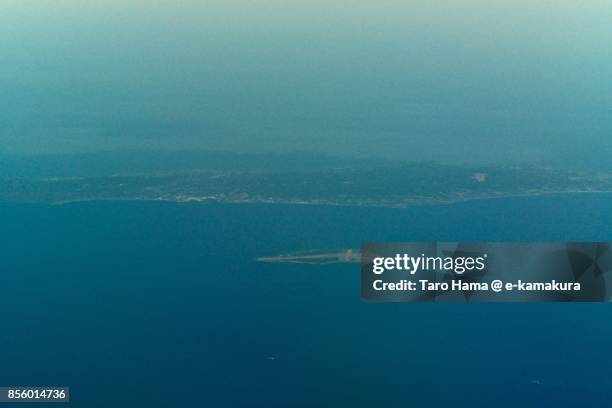 tanegashima and mageshima islands in kagoshima prefecture in japan daytime aerial view from airplane - tanegashima island stockfoto's en -beelden