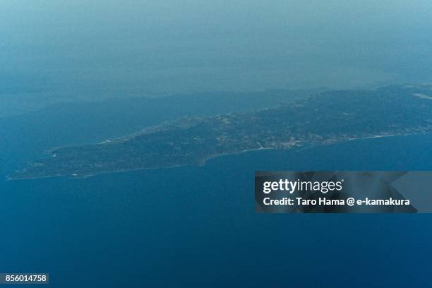 tanegashima island in kagoshima prefecture in japan daytime aerial view from airplane - tanegashima island stock-fotos und bilder