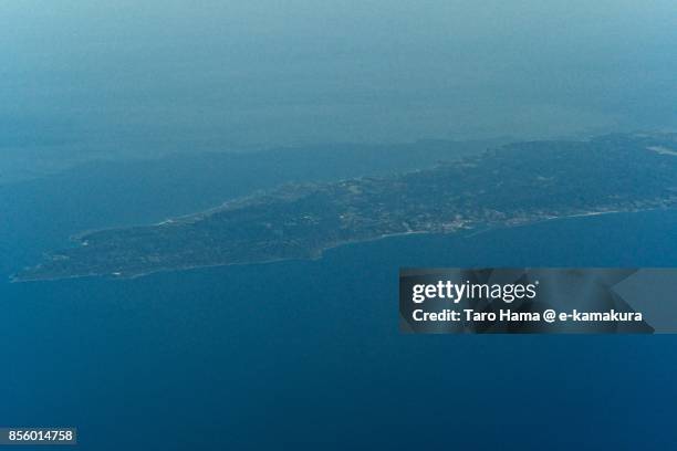 tanegashima island in kagoshima prefecture in japan daytime aerial view from airplane - tanegashima island stockfoto's en -beelden