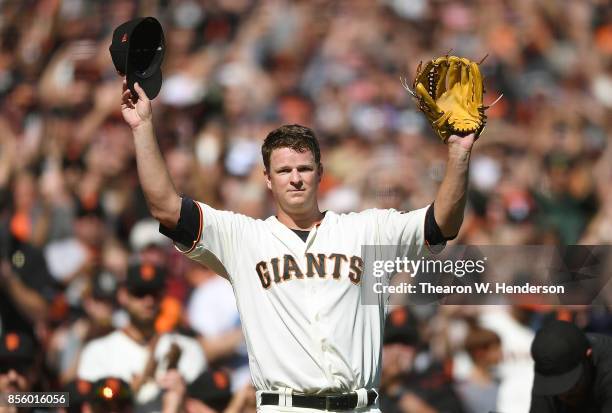 Matt Cain of the San Francisco Giants waves to the fans showing gratitude leaving the game after the top of the fourth inning against the San Diego...