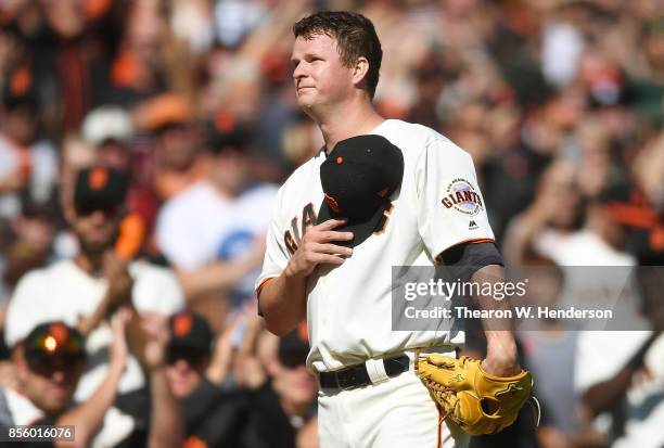 Matt Cain of the San Francisco Giants shows his gratitude to the fans coming out of the game after the top of the fourth inning against the San Diego...