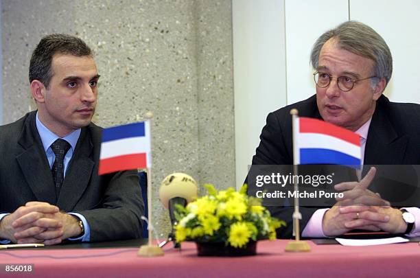 Yugoslav Foreign Minister Goran Svilanovic listens to questions about the slow handover of indictees to the war crimes tribunal at a press conference...