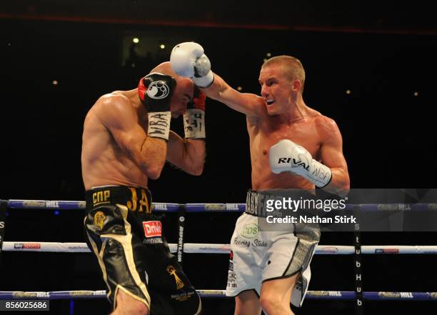Paul Butler lands a shot on Stuart Hall during the Battle on the Mersey Eliminator for WBA Bantamweight World Championship fight at Echo Arena on...
