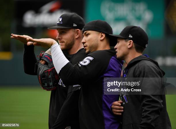 From left to right, Colorado Rockies shortstop Trevor Story, Colorado Rockies right fielder Carlos Gonzalez and Colorado Rockies catcher Tony Wolters...