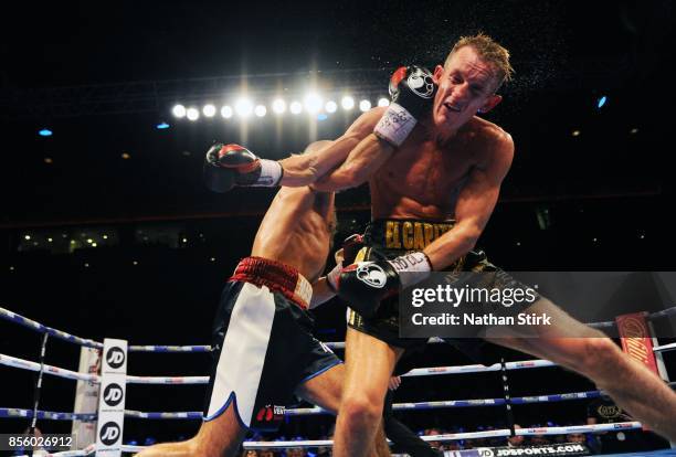 Tom Stalker is punched by Sean Dodd during the Battle on the Mersey Commonwealth Lightweight Championship fight at Echo Arena on September 30, 2017...
