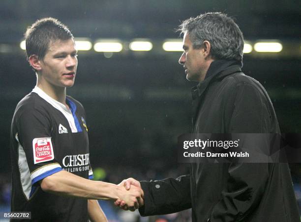 Chelsea's manager Jose Mourinho shakes hands with Macclesfield Town's James Jennings after the final whistle