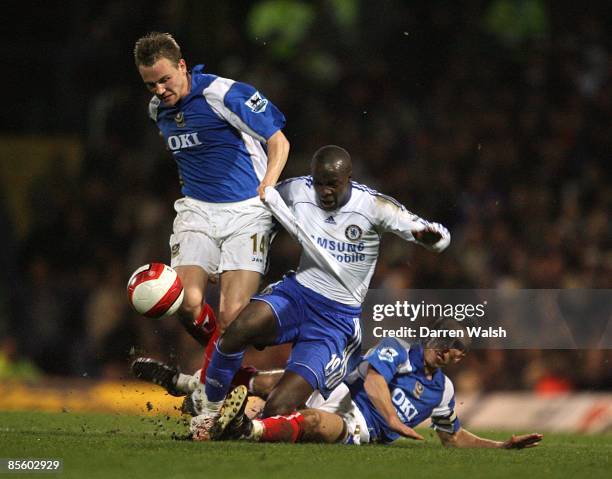 Chelsea's Lassana Diarra is tackled by Portsmouth's Gary O'Neil and Matthew Taylor