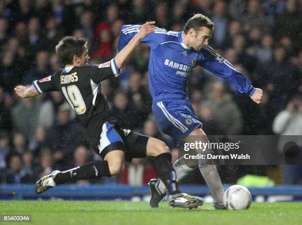 Macclesfield Town's James Jennings challenges Chelsea's Andriy Shevchenkofor the ball