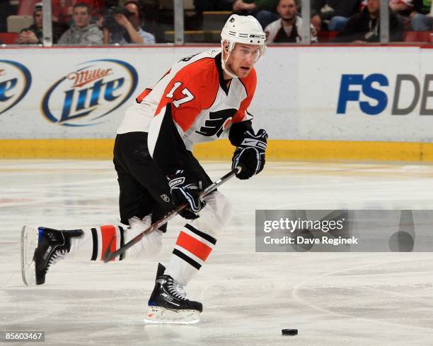 Jeff Carter of the Philadelphia Flyers skates with the puck during a NHL game against the Detroit Red Wings on March 17, 2009 at Joe Louis Arena in...