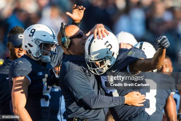 Head coach James Franklin of the Penn State Nittany Lions and Trace McSorley congratulate DaeSean Hamilton after a touchdown reception during the...