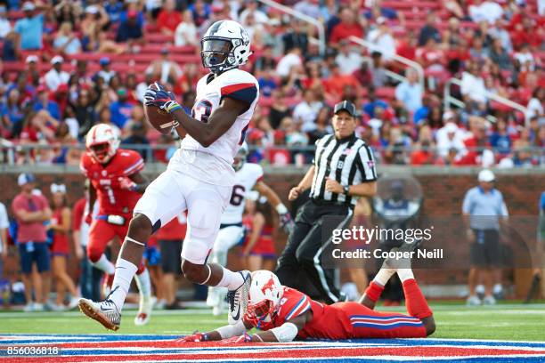 Keyion Dixon of the Connecticut Huskies breaks free for a 59 yard touchdown reception against the SMU Mustangs during the second half at Gerald J....