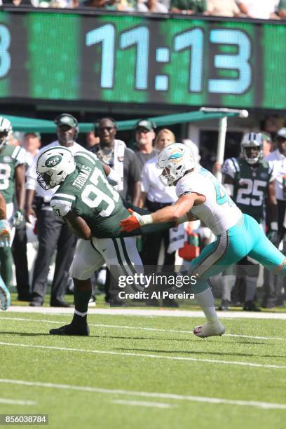 Defensive Lineman Lawrence Thomas of the New York Jets makes a catch against the Miami Dolphins on September 24, 2017 at MetLife Stadium in East...