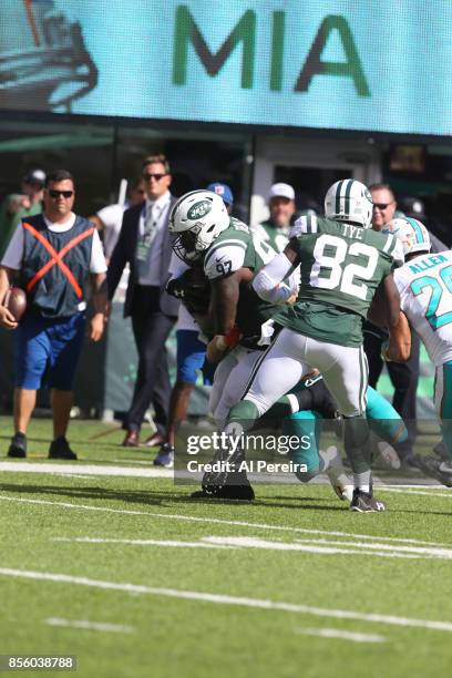 Defensive Lineman Lawrence Thomas of the New York Jets makes a catch against the Miami Dolphins on September 24, 2017 at MetLife Stadium in East...