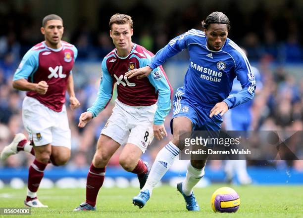 Chelsea's Didier Drogba gets away from West Ham United's Scott Parker