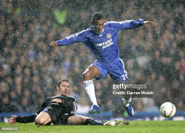 Chelsea's Salomon Kalou is fouled by Macclesfield Town's Kevin McIntyre