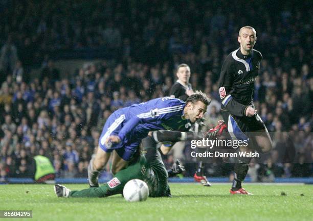 Macclesfield Town's goalkeeper Tommy Lee fouls Chelsea's Andriy Shevchenko