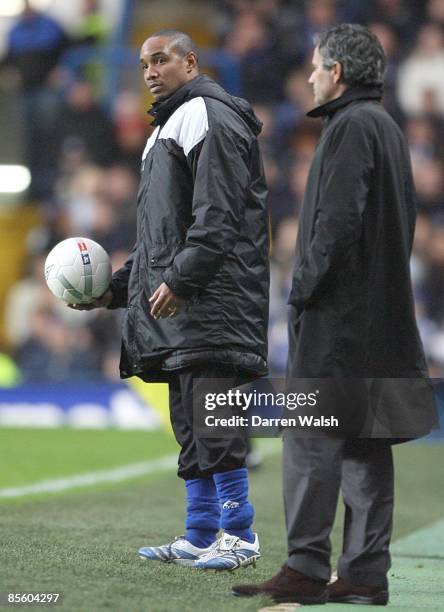 Chelsea's manager Jose Mourinho and Macclesfield Town's manager Paul Ince stand on the touchline