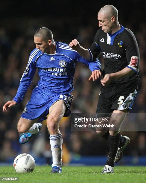 Chelsea's Ben Sahar is challenged by Macclesfield Town's Danny Swailes