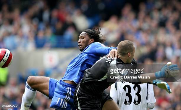 Chelsea's Didier Drogba challenges Tottenham Hotspur goalkeeper Paul Robinson