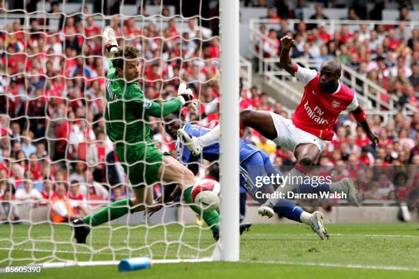 Chelsea's Michael Essien scores the equaliser past Arsenal goalkeeper Jens Lehmann