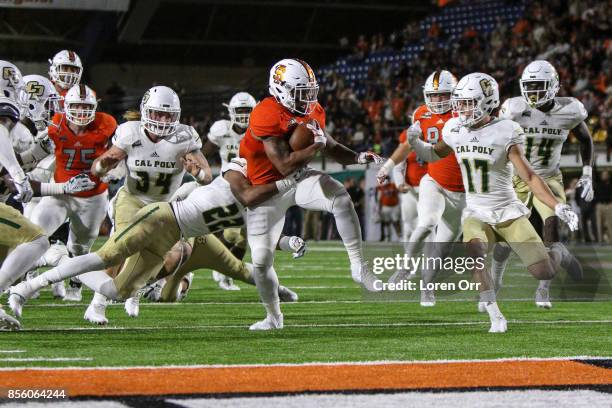 Running back James Madison of the Idaho State Bengals high steps towards the end zone during second half action against the Cal Poly Mustangs on...