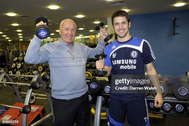 Chelsea's Joe Cole and former player Peter Brabrook lift some weights in the gym