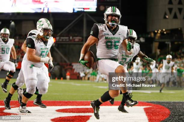 Ryan Yurachek of the Marshall Thundering Herd celebrates after scoring a touchdown against the Cincinnati Bearcats during the first half at Nippert...