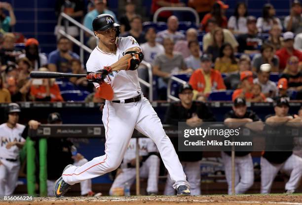 Giancarlo Stanton of the Miami Marlins hits during a game against the Atlanta Braves at Marlins Park on September 30, 2017 in Miami, Florida.