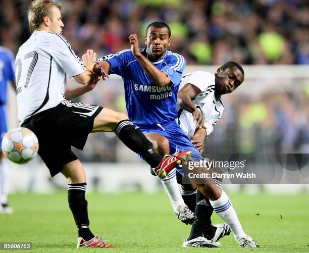 Chelsea's Ashley Cole is tackled by Abdoulrazak Traore and Marek Sapara