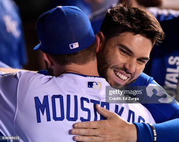 Mike Moustakas of the Kansas City Royals receives a hug from Eric Hosmer after he was taken out of a game against the Arizona Diamondbacks in the...