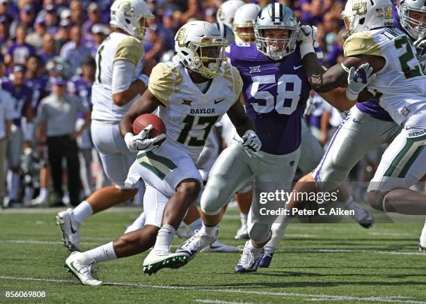 Wide receiver Tony Nicholson of the Baylor Bears rushes with the ball against the Kansas State Wildcats during the first half on September 30, 2017...