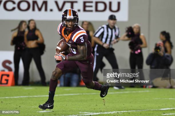 Greg Stroman of the Virginia Tech Hokies carries the ball during the second quarter against the Clemson Tigers at Lane Stadium on September 30, 2017...