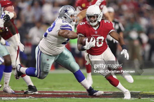 Running back Andre Ellington of the Arizona Cardinals rushes the football against the Dallas Cowboys during the NFL game at the University of Phoenix...