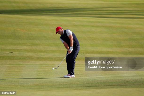 Golfer Patrick Reed chips on the 4th hole during the third round of the Presidents Cup at Liberty National Golf Club on September 30, 2017 in Jersey...