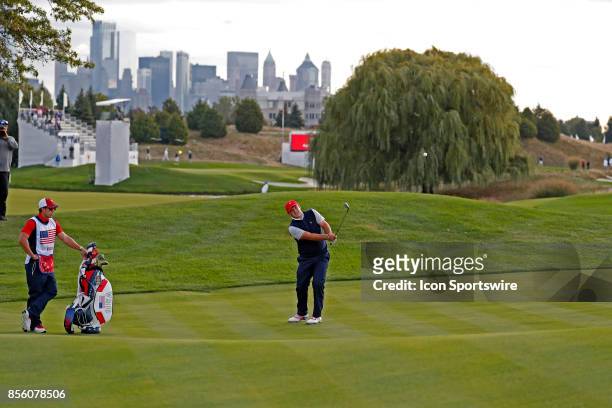 Golfer Patrick Reed chips on the 5th hole during the third round of the Presidents Cup at Liberty National Golf Club on September 30, 2017 in Jersey...