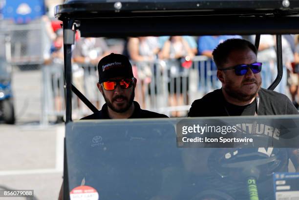 Martin Truex Jr, Monster Energy NASCAR Cup Series driver of the Furniture Row / Denver Mattress Toyota , arrives for the driver's meeting during the...