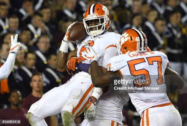 Dorian O'Daniel of the Clemson Tigers celebrates after returning an interception for a touchdown during the fourth quarter against the Virginia Tech...
