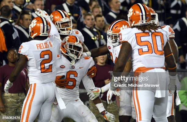 Dorian O'Daniel of the Clemson Tigers celebrates after returning an interception for a touchdown during the fourth quarter against the Virginia Tech...