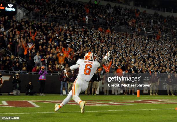 Dorian O'Daniel of the Clemson Tigers returns an interception for a touchdown during the fourth quarter against the Virginia Tech Hokies at Lane...