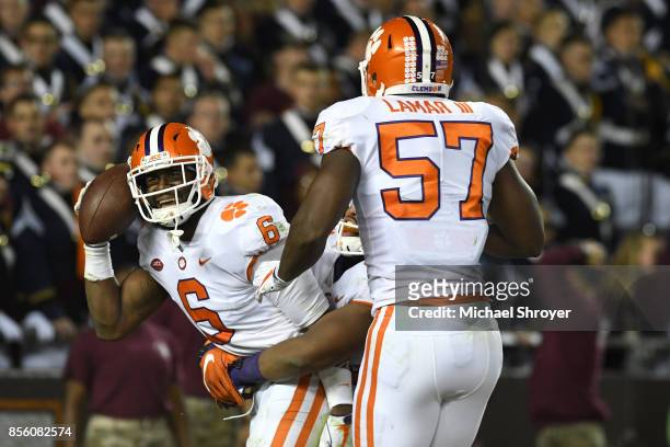Dorian O'Daniel of the Clemson Tigers celebrates after returning an interception for a touchdown during the fourth quarter against the Virginia Tech...
