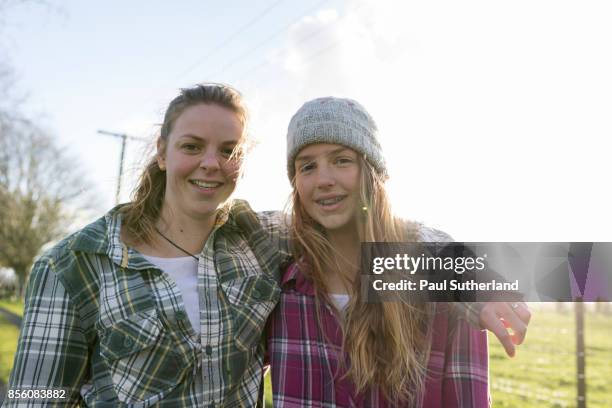 farm girls side by side looking to camera. - matamata stock pictures, royalty-free photos & images