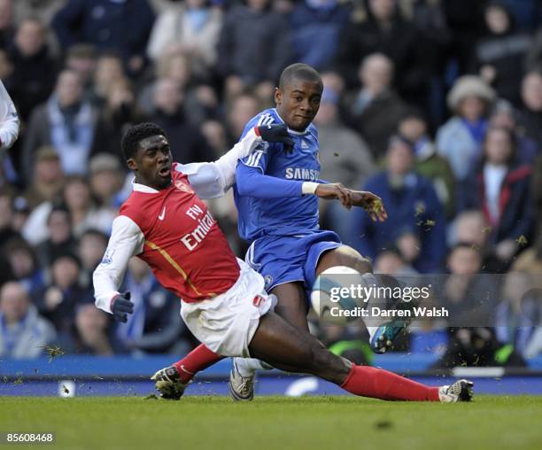 Chelsea's Salomon Kalou and Arsenal's Kolo Toure battle for the ball