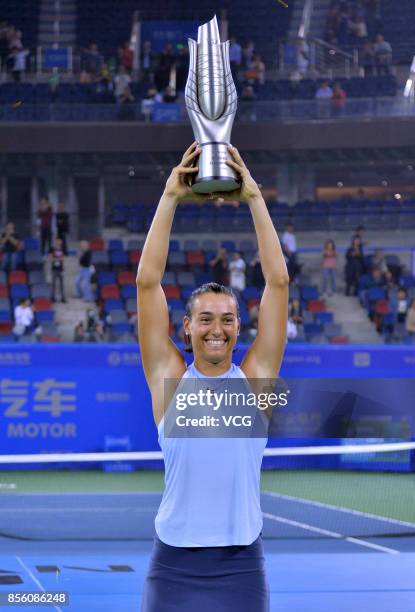 Caroline Garcia of France poses with her trophy after winning the ladies singles final against Ashleigh Barty of Australia on Day 7 of 2017 Dongfeng...