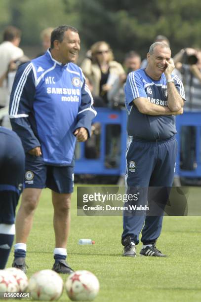 Chelsea manager Avram Grant shares a joke with coach Henk Ten Cate during training