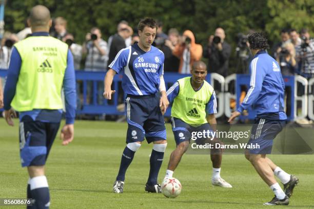 Chelsea's John Terry and Florent Malouda during training