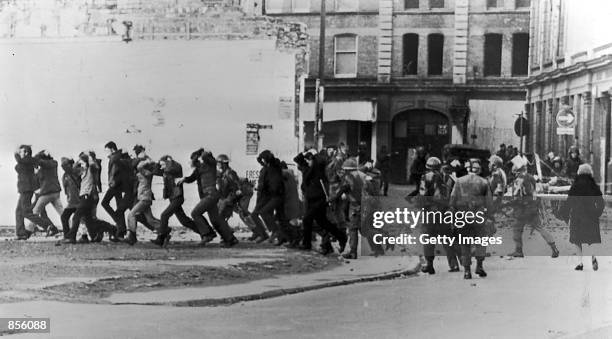 British paratroopers take away civil rights demonstrators on "Bloody Sunday" after the paratroopers opened fire on a civil rights march, killing 14...